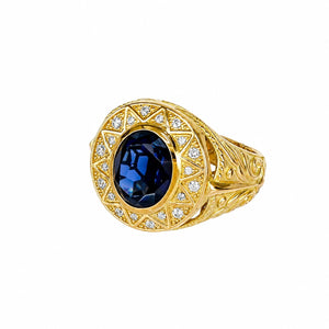 Anillo con piedra azul, en oro 18k