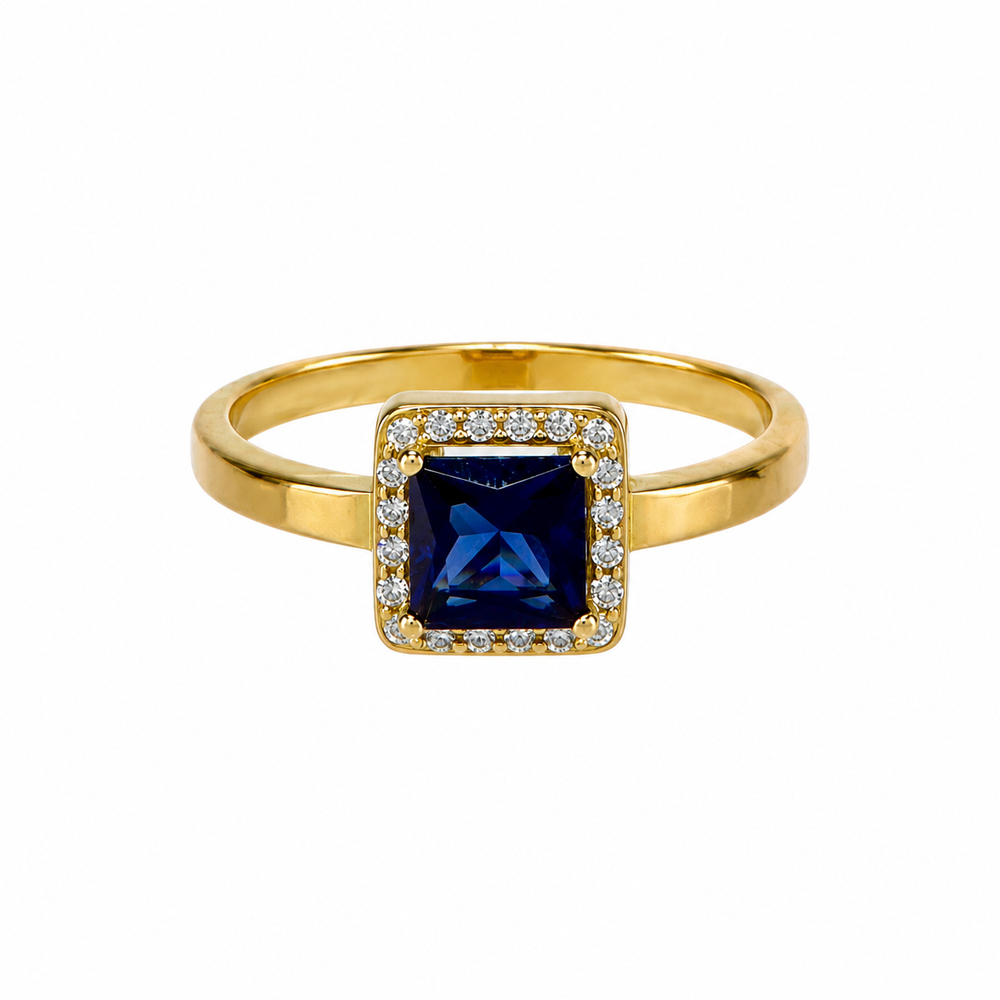 Solitario con piedra azul, en oro 18k