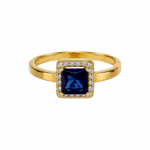 Solitario con piedra azul, en oro 18k